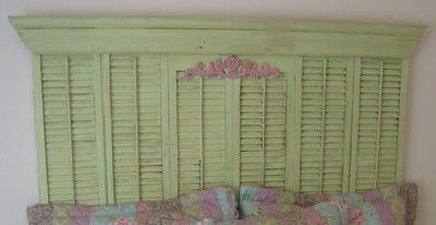 Use salvaged shutters to create a cottage-style headboard.