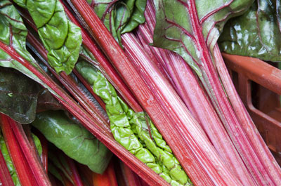 Fresh Swiss chard ready for action in a food photo. [Credit: Focal length: 55mm, Shutter speed: 1/2