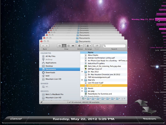 The Time Machine application is ready to restore a file in the Finder.