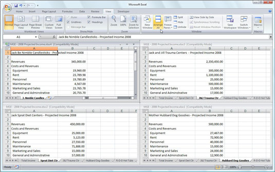 Arrange four worksheet windows with the Tiled option.