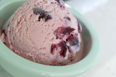 A fresh scoop of homemade cherry ice cream. [Credit: Focal length: 52mm, Shutter speed: 1/25 sec.,