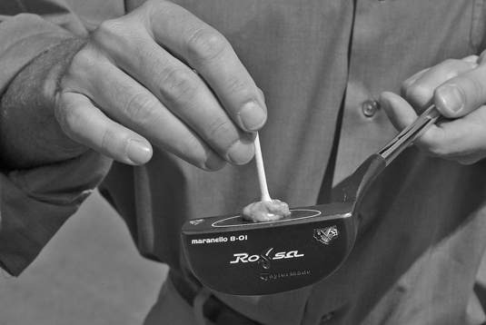Stick a tee to the face of your putter to help align your club with your target.