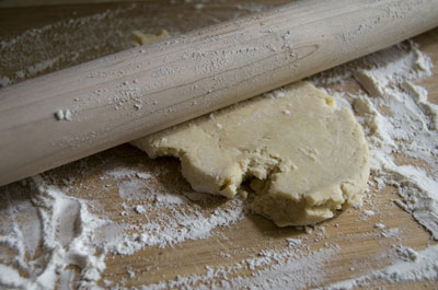 Rolling out dough. [Credit: Focal length: 32mm, Shutter speed: 1/20 sec., Aperture: f/4.5, ISO valu