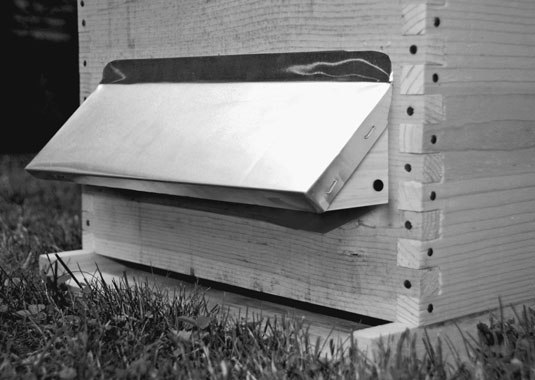A simple front porch adds some whimsy to your hives. [Credit: Photograph courtesy of Howland Blacki
