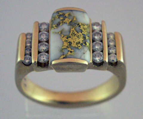 A quartz stone with gold inclusions and diamonds, photographed with the cloud dome.